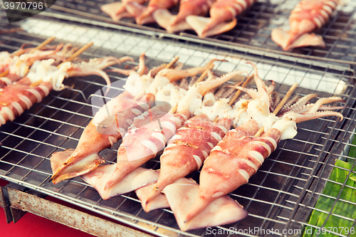 Image of grilled squids at street market