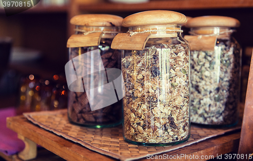 Image of close up of jars with granola at grocery store
