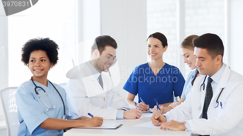 Image of group of happy doctors meeting at hospital office