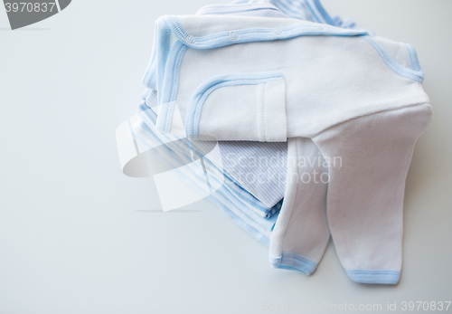 Image of close up of baby boys clothes for newborn on table