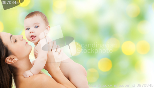 Image of happy mother holding adorable baby