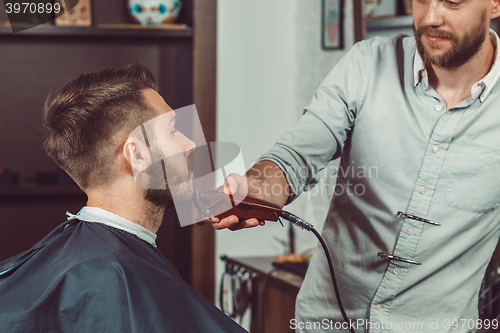Image of Hipster client visiting barber shop