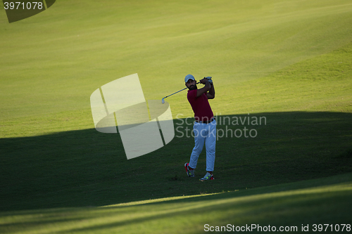 Image of golf player hitting long shot