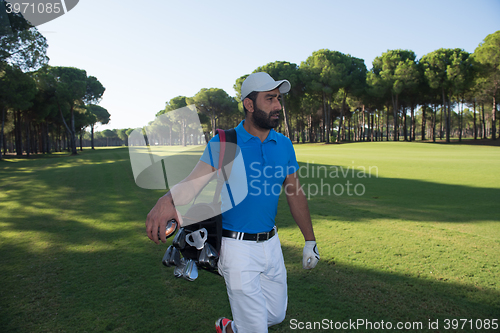 Image of golf player walking