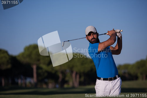 Image of pro golfer hitting a sand bunker shot