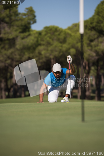 Image of golf player aiming perfect  shot