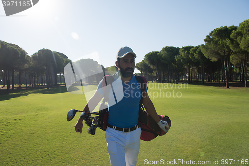 Image of golf player walking