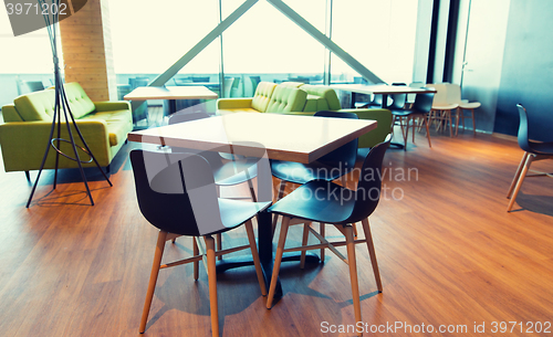 Image of restaurant interior with table and chairs