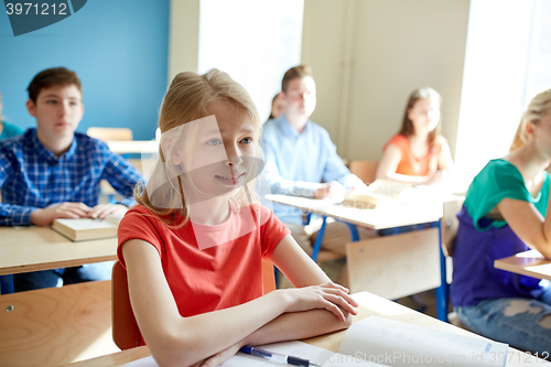 Image of happy student girl at school lesson