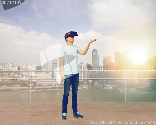 Image of happy man in virtual reality headset or 3d glasses