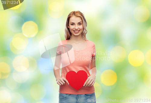 Image of happy woman or teen girl with red heart shape