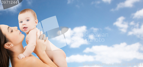 Image of happy mother holding adorable baby