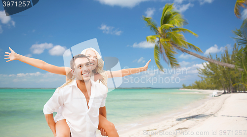 Image of happy couple having fun over summer beach