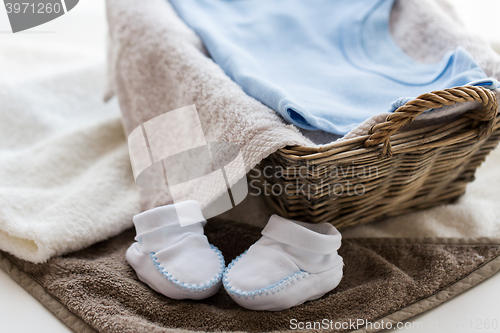 Image of close up of baby clothes for newborn boy in basket