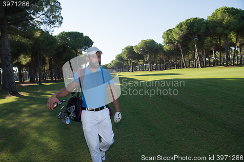 Image of golf player walking