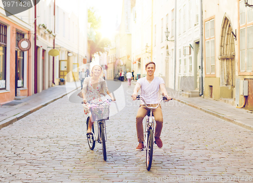 Image of couple with bicycles in the city