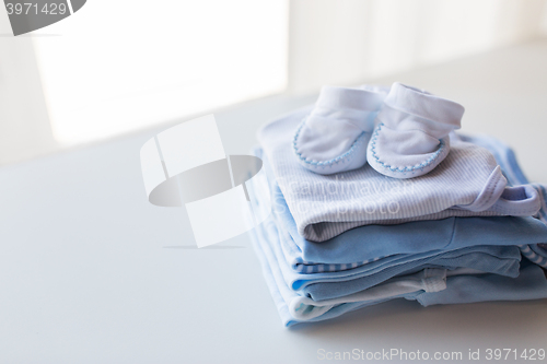 Image of close up of baby boys clothes for newborn on table