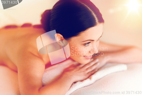 Image of woman in spa with hot stones