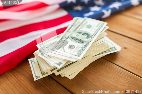 Image of close up of american flag and dollar cash money