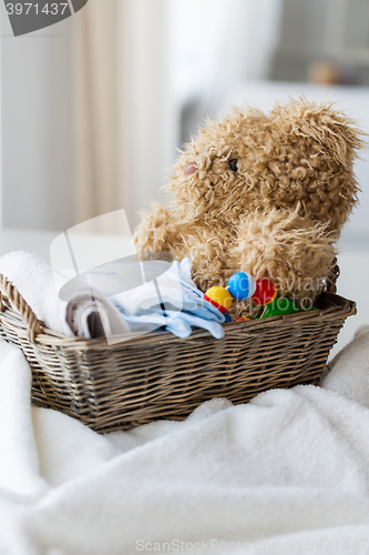 Image of close up of baby clothes and toys for newborn