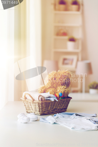 Image of close up of baby clothes and toys for newborn