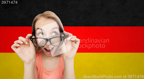 Image of happy young woman or teenage girl in eyeglasses