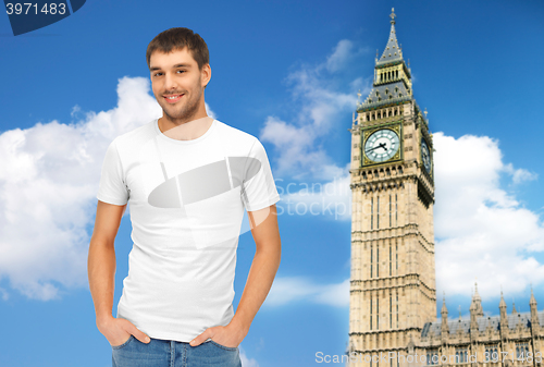 Image of happy man in blank white t-shirt over big ben