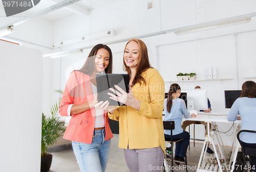 Image of creative team with table pc in office