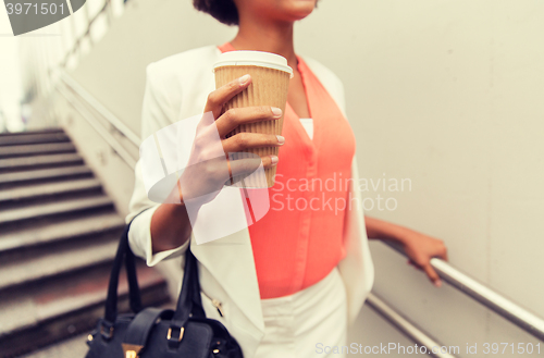 Image of close up of african businesswoman with coffee
