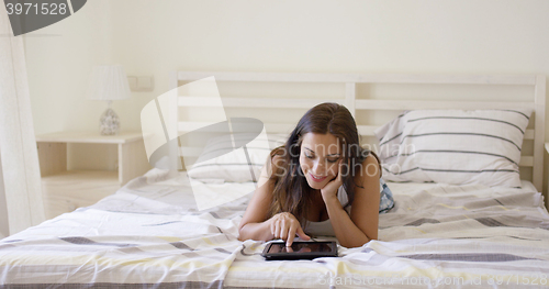 Image of Attractive young woman surfing the internet