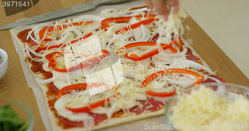 Image of Woman make a tasty traditional homemade pizza