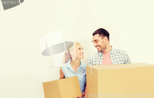 Image of couple with delivery boxes moving to new home