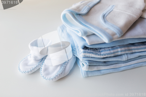 Image of close up of baby boys clothes for newborn on table