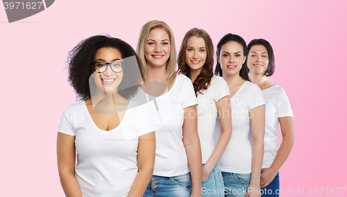 Image of group of happy different women in white t-shirts