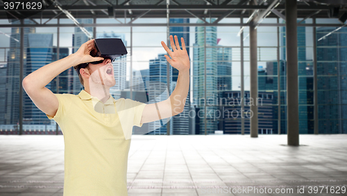 Image of happy man in virtual reality headset or 3d glasses