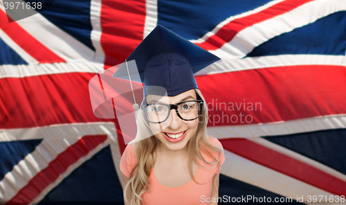 Image of student woman in mortarboard over english flag