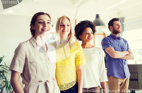 Image of happy creative team in office