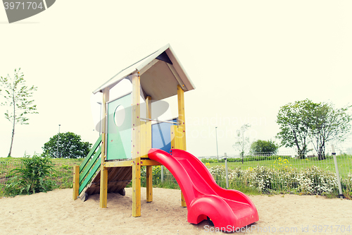Image of slide on playground outdoors