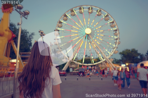 Image of Teen girl at park of amusement