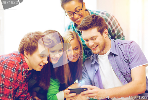 Image of students looking at smartphone at school