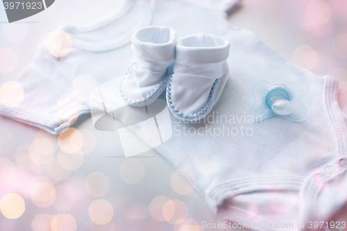 Image of close up of baby boys clothes for newborn on table