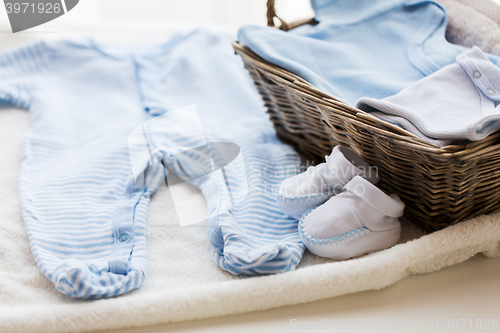 Image of close up of baby clothes for newborn boy in basket