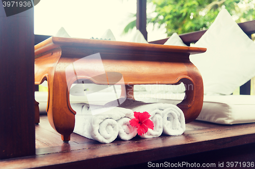 Image of rolled bath towels at hotel spa