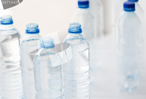 Image of close up of bottles with drinking water on table