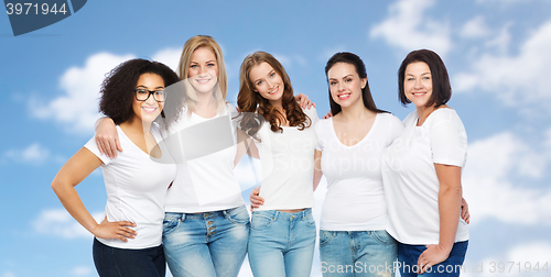 Image of group of happy different women in white t-shirts