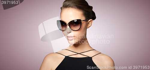 Image of beautiful young woman in elegant black sunglasses