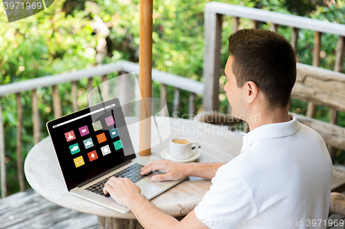 Image of close up of businessman with laptop on terrace