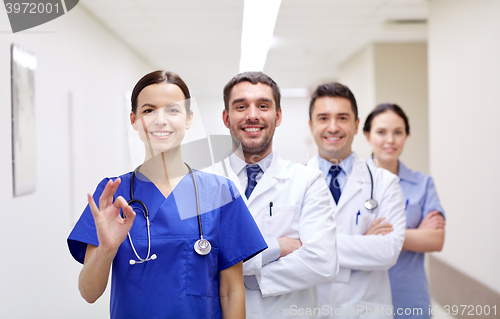 Image of group of happy medics or doctors at hospital