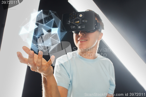 Image of happy man in virtual reality headset or 3d glasses