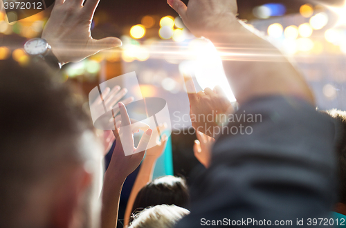 Image of close up of happy people at concert in night club